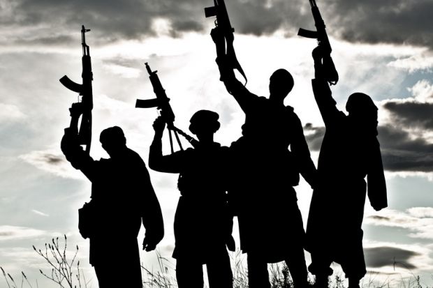 silhouettes-of-islamic-terrorists-aiming-guns-at-sky